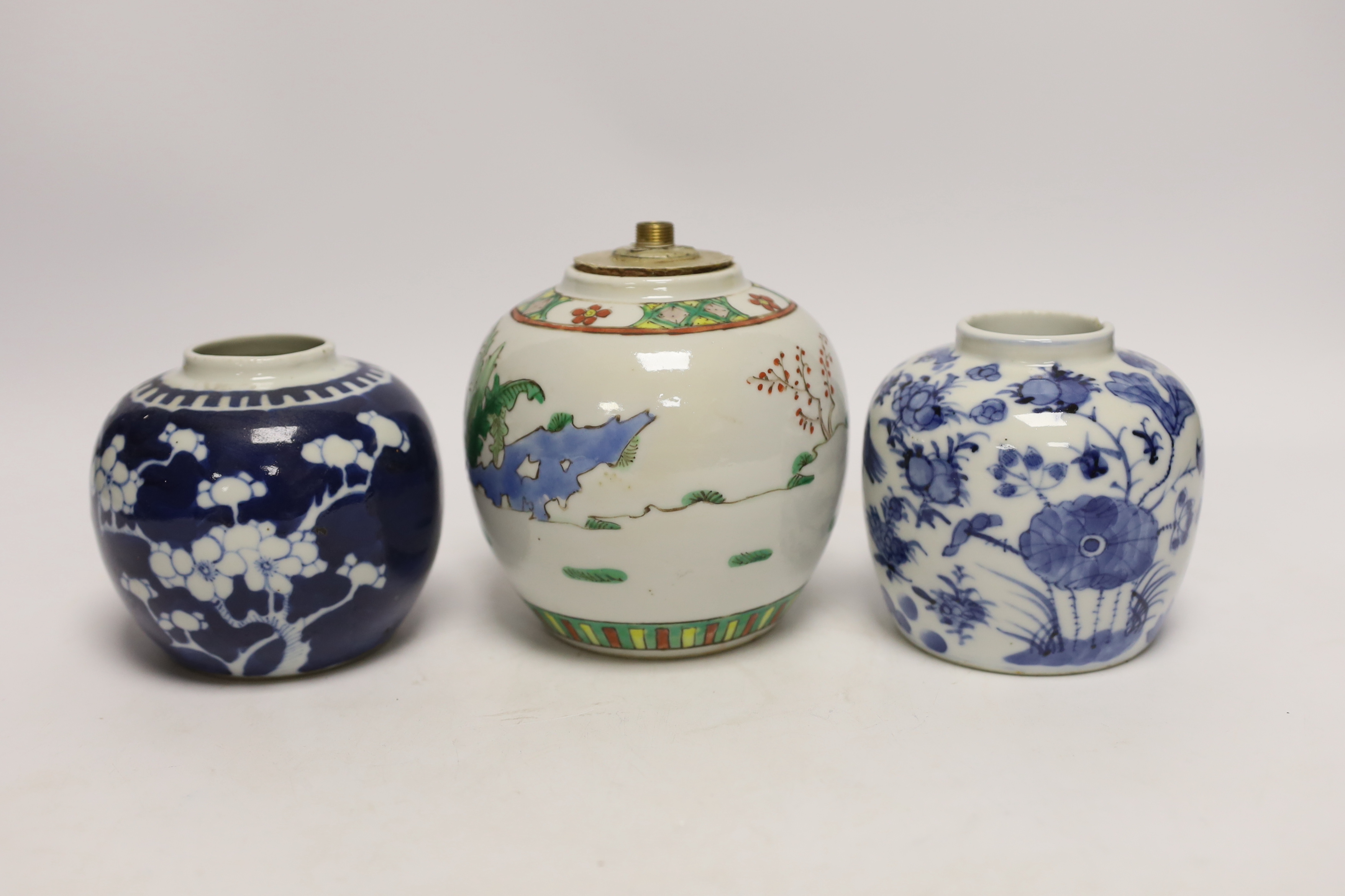 Three Chinese ginger jars, including a blue and white prunus example, Late 19th/early 20th century, largest 13cm high